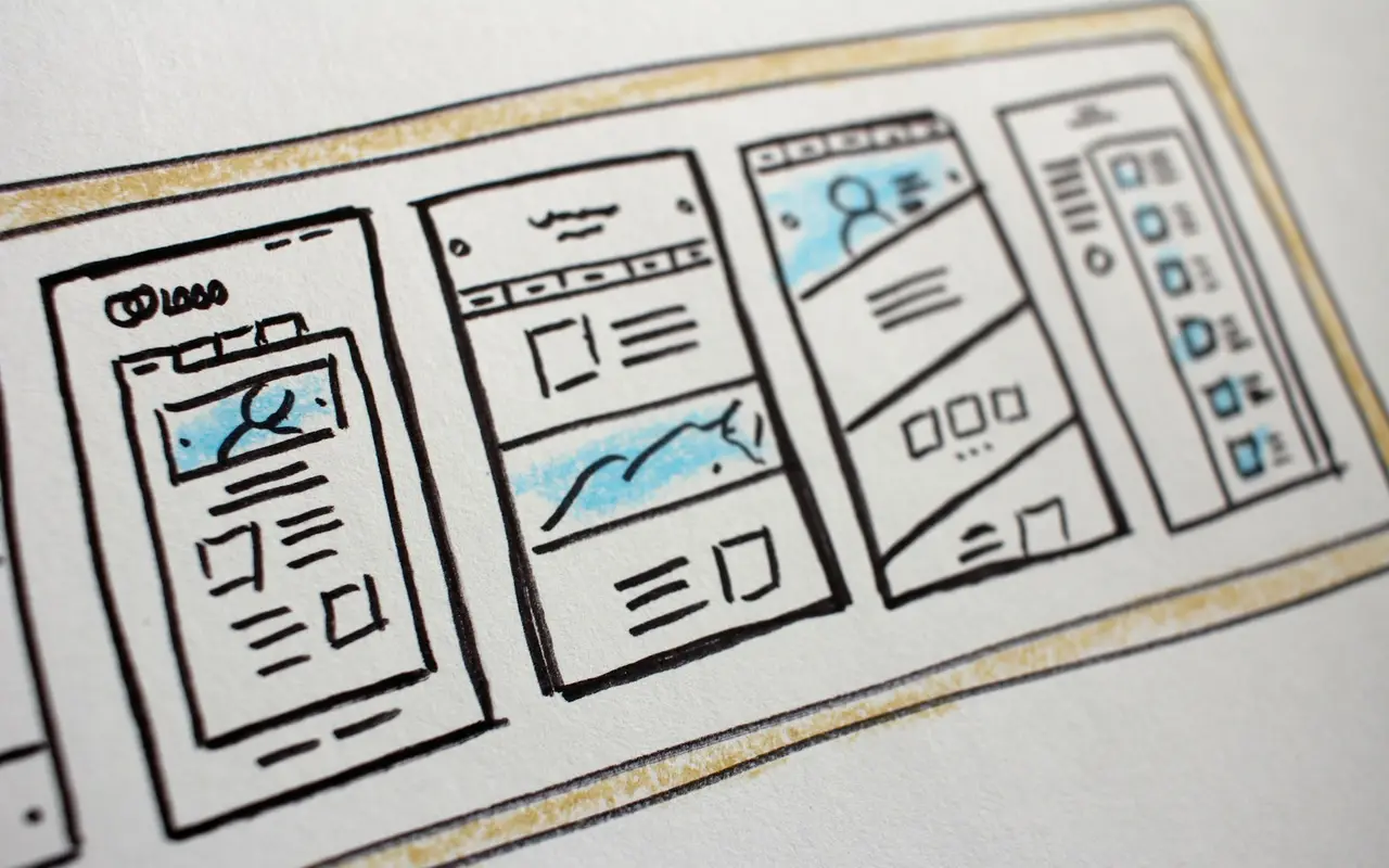 Hand-drawn sketches of mobile app screens, the starting point of a real estate app project