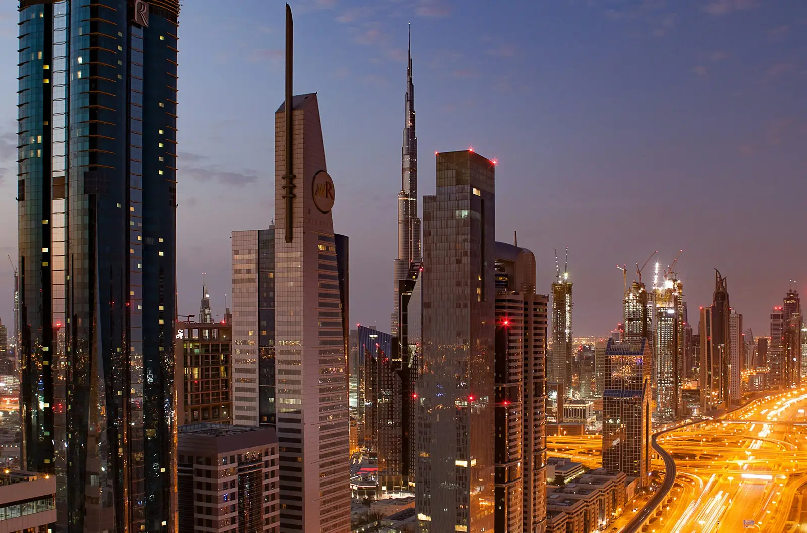 Downtown Dubai skyline at night, home to many of the real estate brokers and developers CubicSofts works with