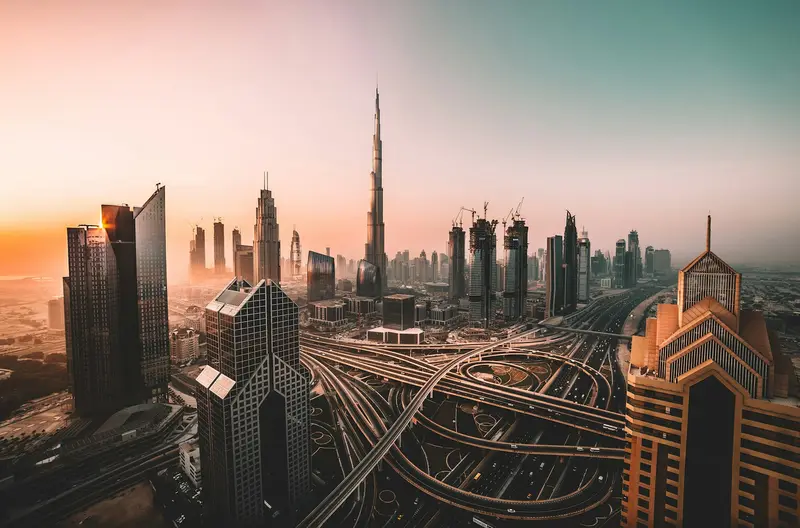 Dubai skyline with Burj Khalifa at sunrise over Sheikh Zayed Road, the market real estate SEO competes in