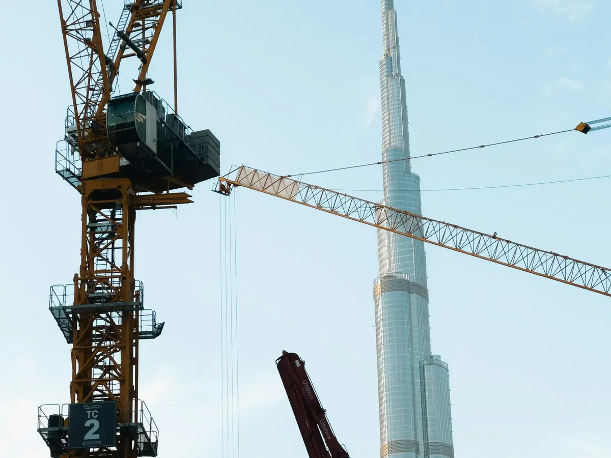Tower crane on a construction site next to Burj Khalifa in Dubai, the kind of off-plan project a developer website launches