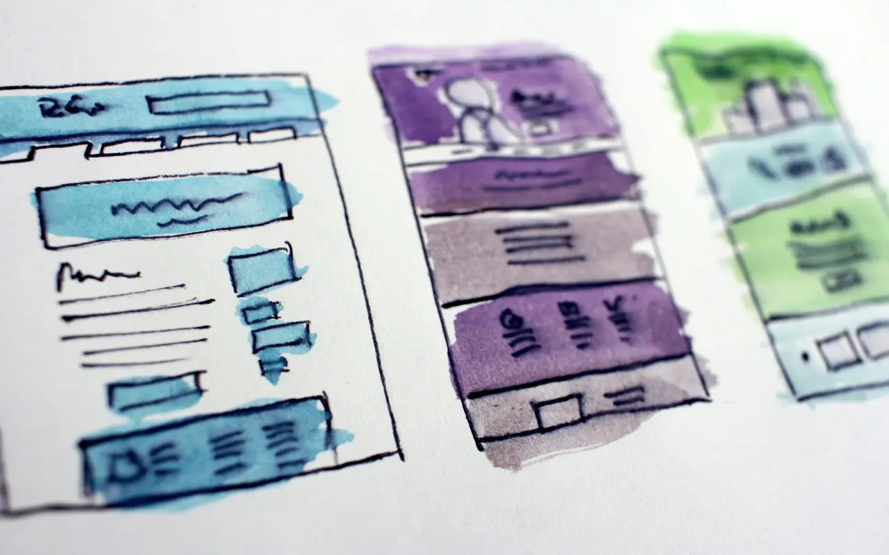 Hand-drawn wireframe sketches of website page layouts, the first step of a real estate website project